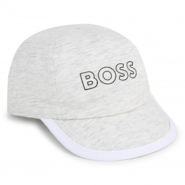Reversible bi-material cap BOSS for BOY