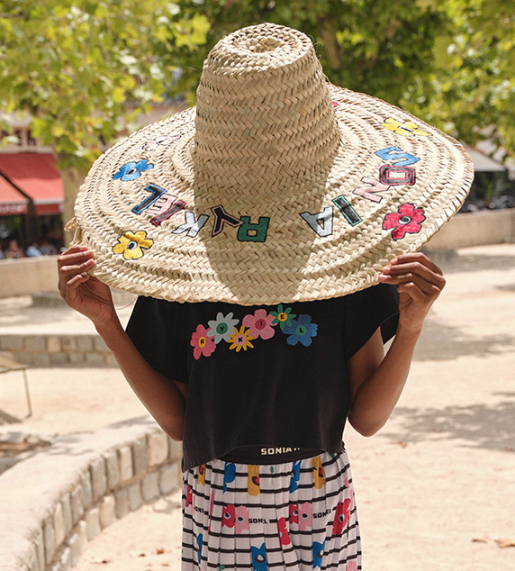 straw hat and flower dress for children by sonia rykiel