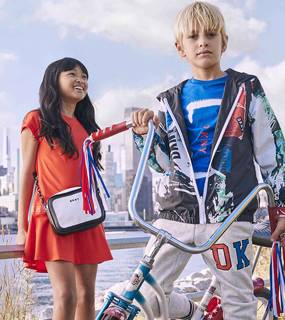 Red dress, coloured jacket and blue t-shirt from DKNY for boys and girls